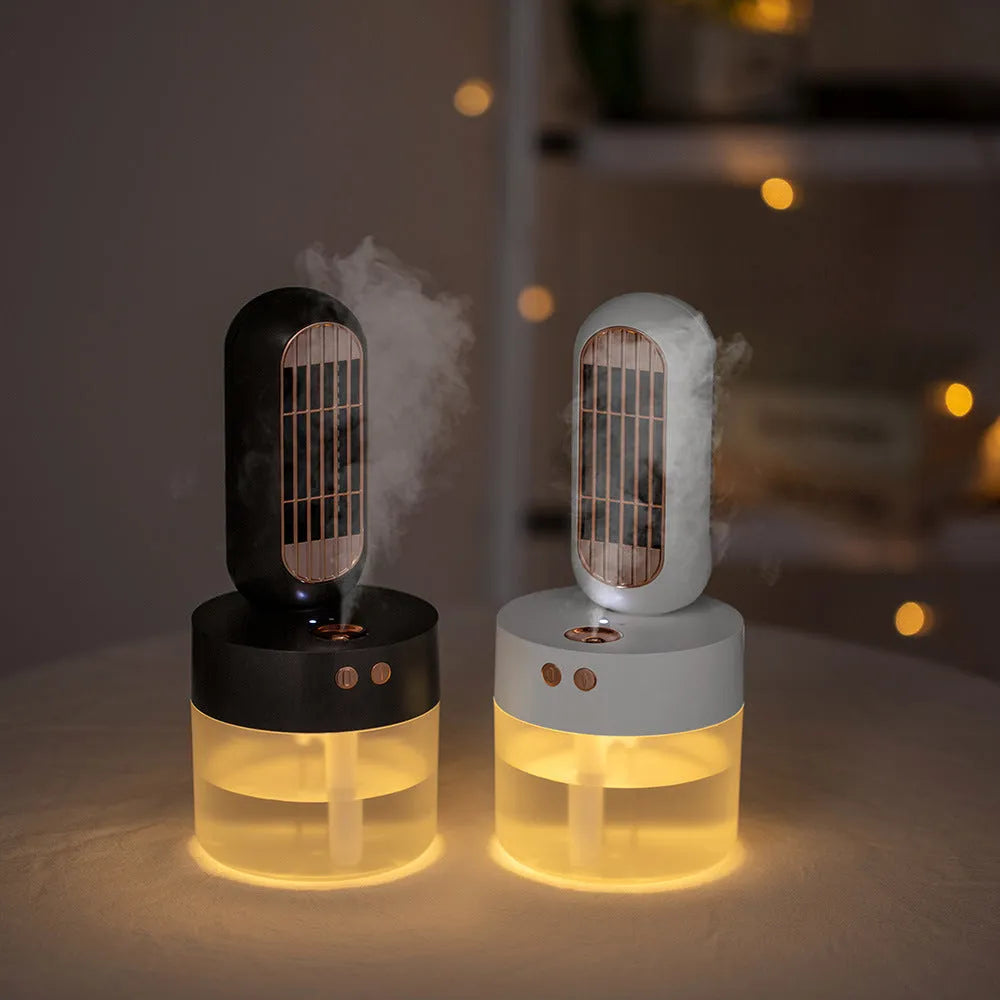 Small black and white humidifier fan with oscillating head on a table