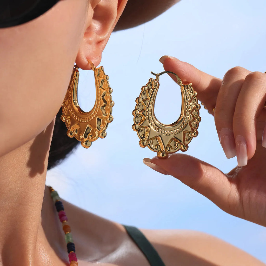 Stainless steel geometric hollow earrings in gold electroplated round shape for women fashion OL style