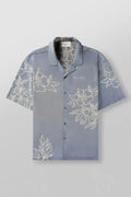Man's loose-fitting short sleeve cardigan top with a floral print in light colours.