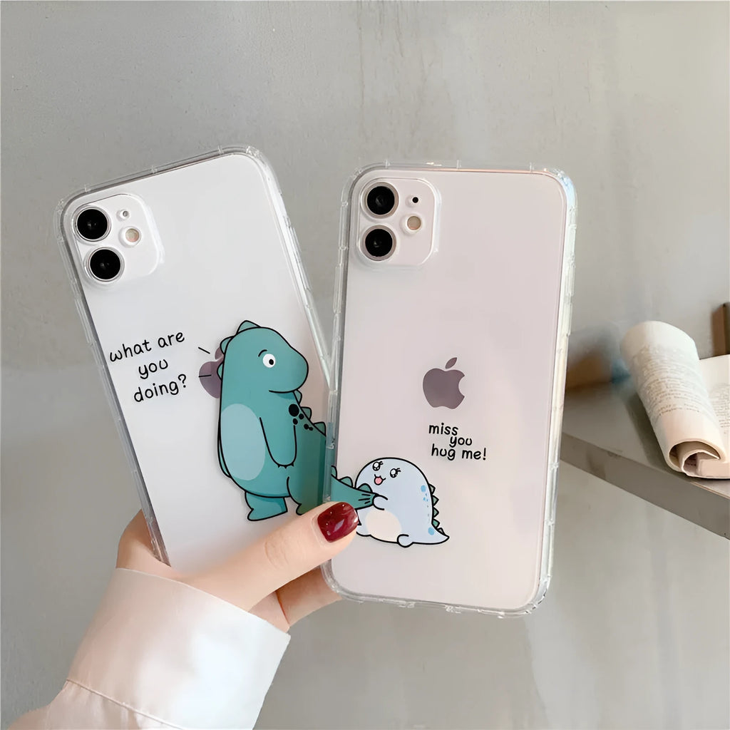 Clear transparent iPhone case with green dinosaur design showing phone protection