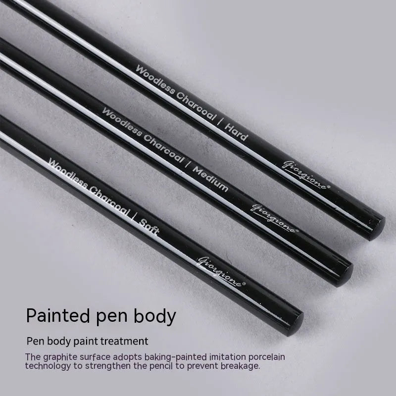 Set of nine graphite and carbonised drawing pencils in wooden casings on a suction card.