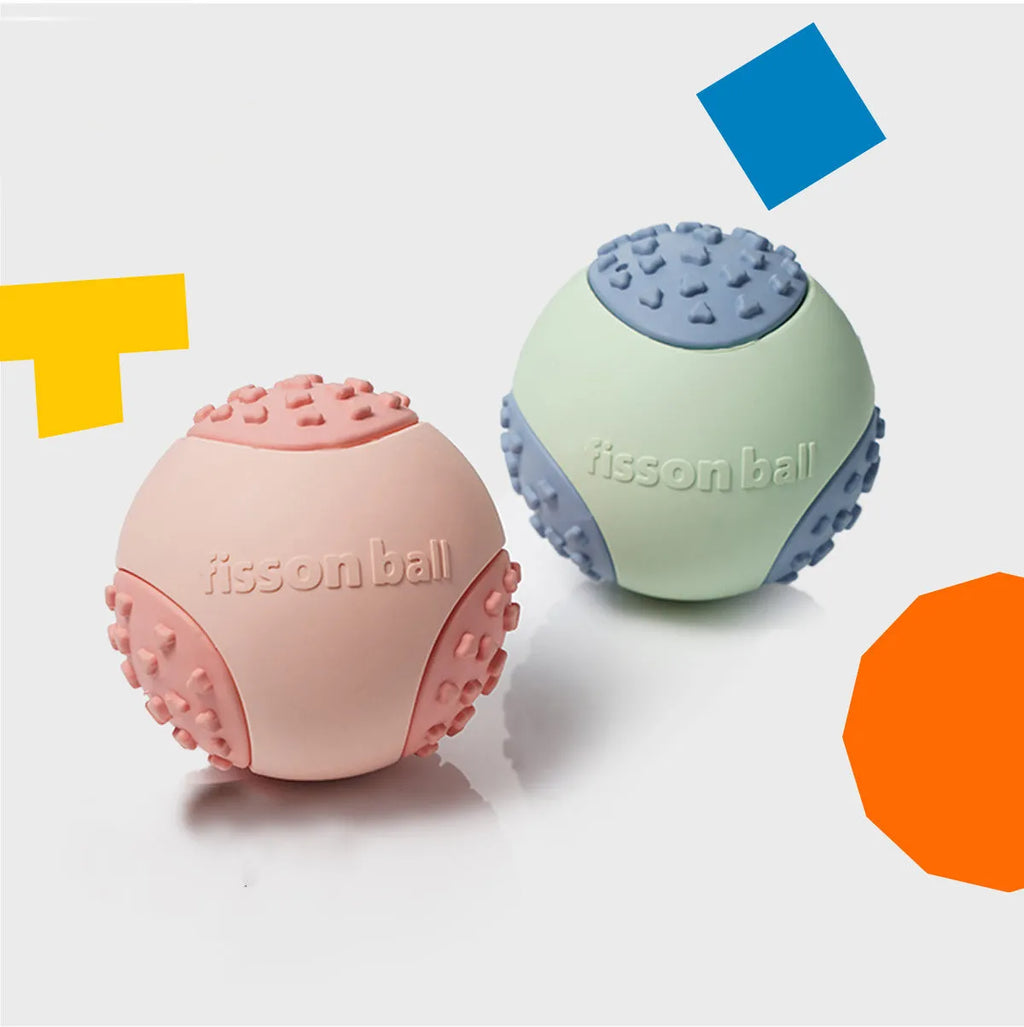 Green and pink motion-activated rolling ball dog toy for small to medium dogs