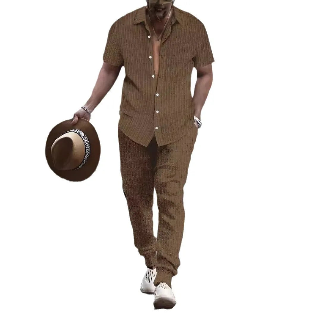 Men's loose fit casual beach suit set in cotton blend fabric, showing short sleeve shirt and trousers.