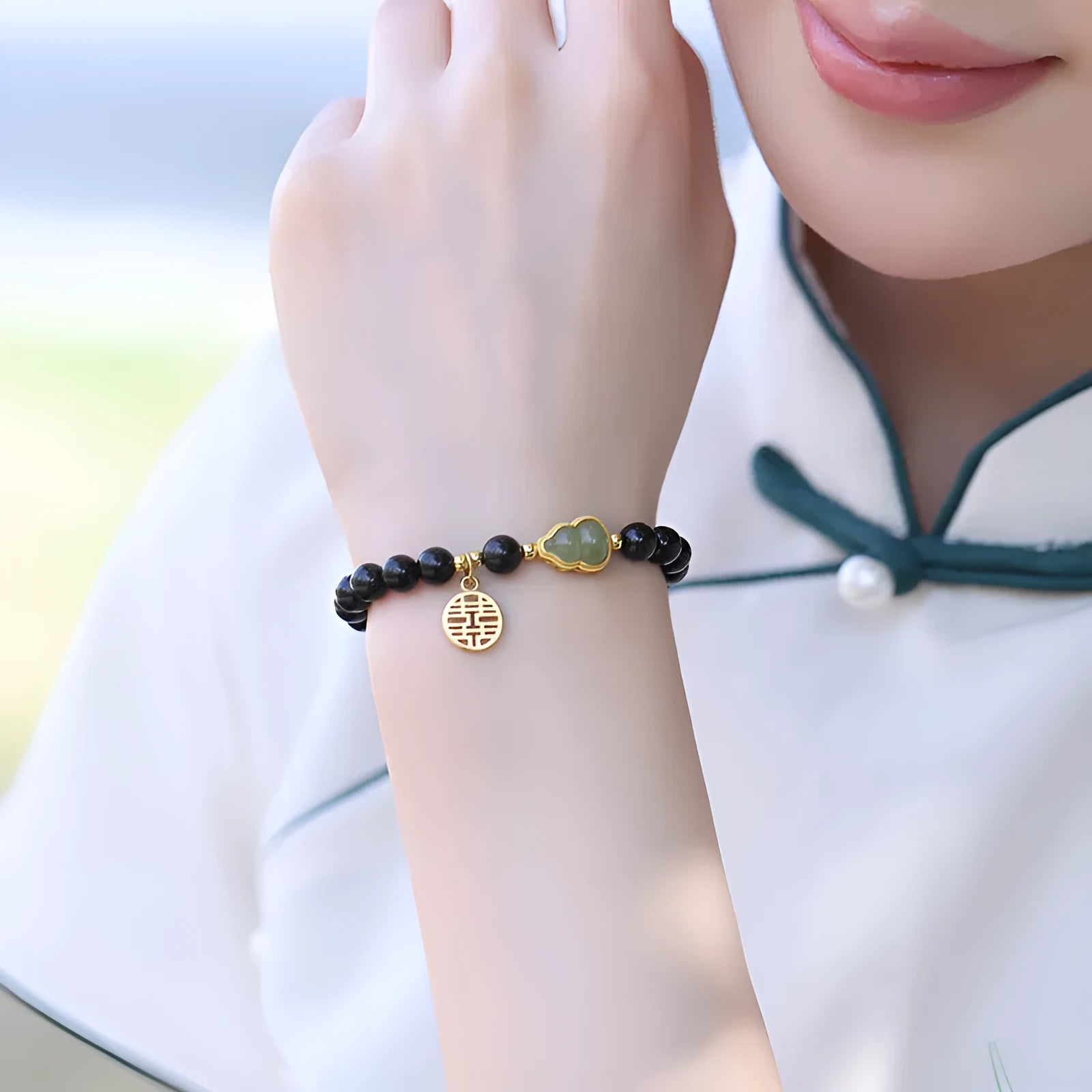 Black obsidian bracelet with Hetian jade gourd charm in 6mm, 8mm, or 10mm bead sizes