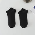 Men's solid colour low-cut polyester boat socks in various colours on white background