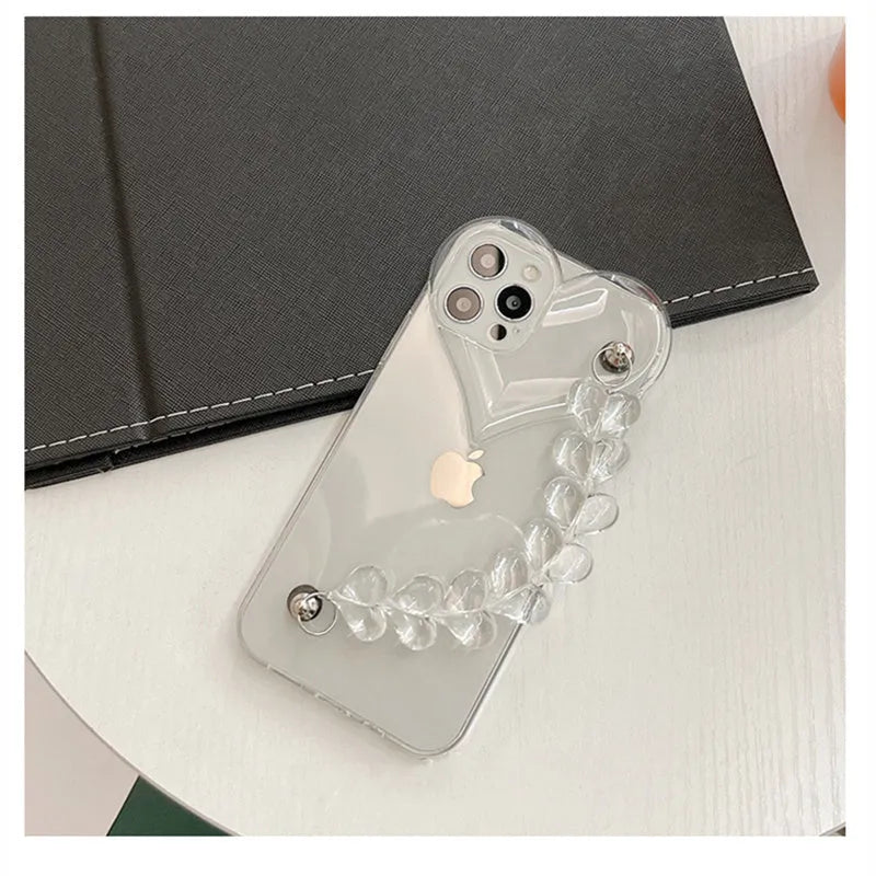 Transparent clear iPhone case with a love heart chain design on a smartphone.