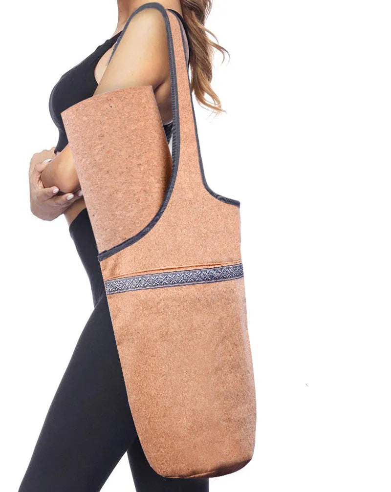 Cork yoga backpack with bohemian style, wide shoulder straps, and multiple pockets for mat, water bottle, and accessories.