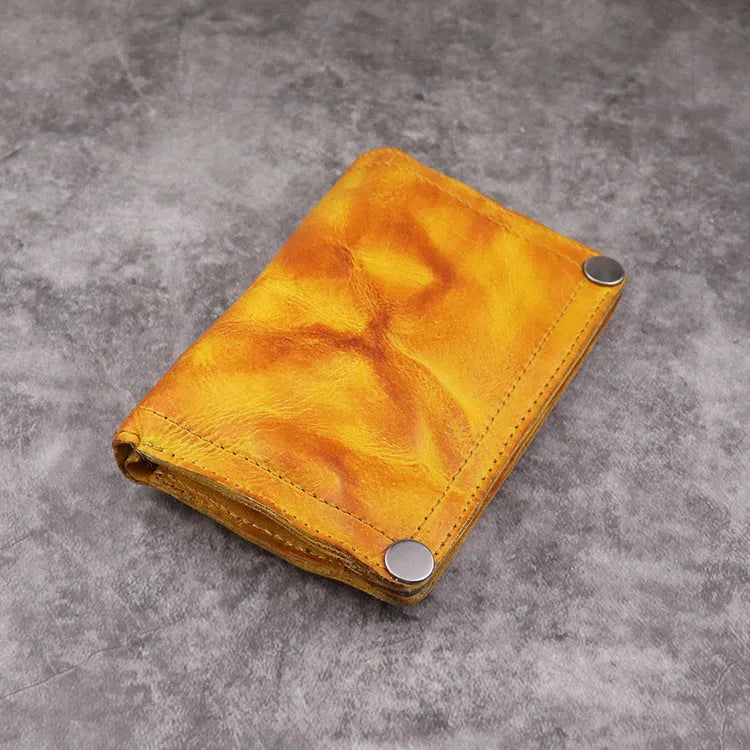 Men's retro style vertical long wallet in genuine cowhide leather showing multiple internal card slots and compartments.