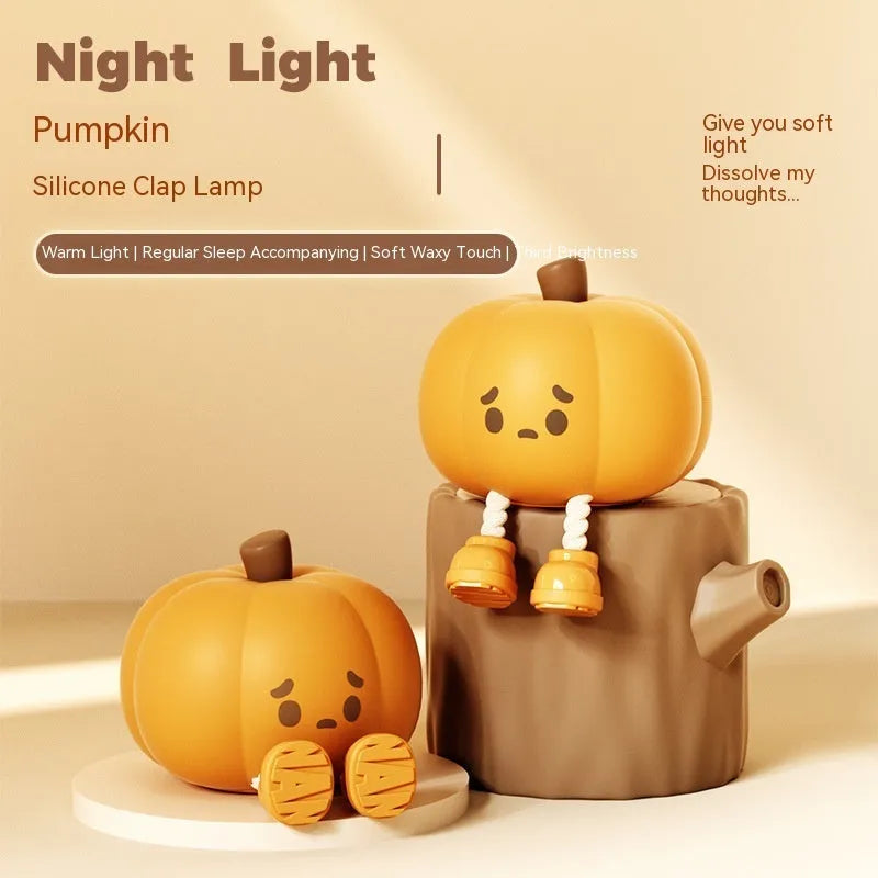 Orange pumpkin silicone night light with soft glowing illumination and touch controls