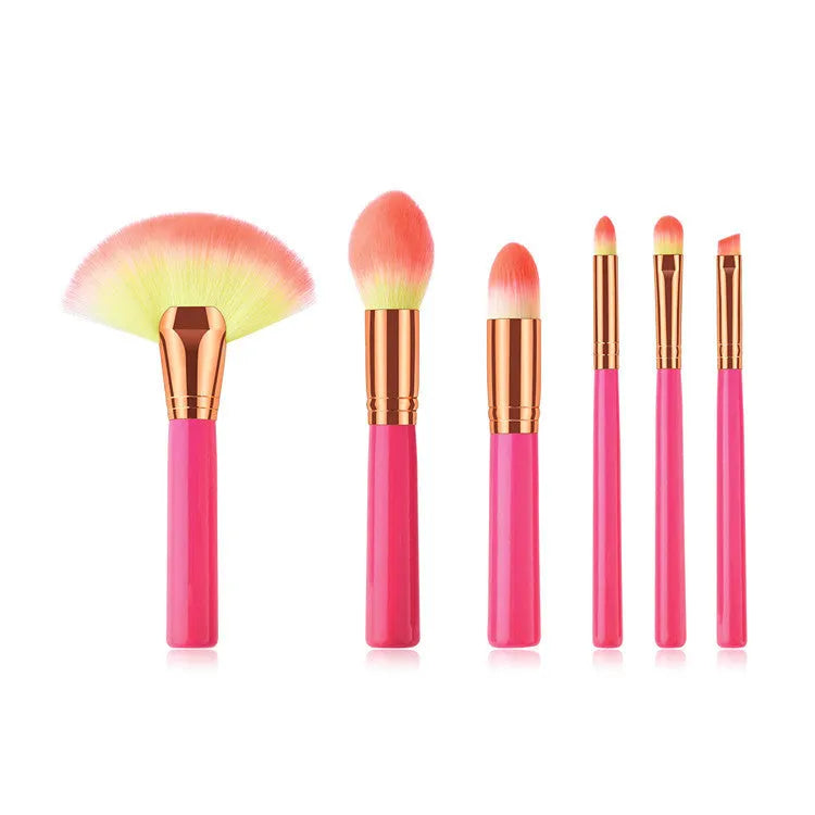Pink wooden handle synthetic bristle makeup brush set in a compact case