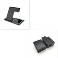 Three-in-one wireless charger folding stand in space black charging a phone, watch, and headset
