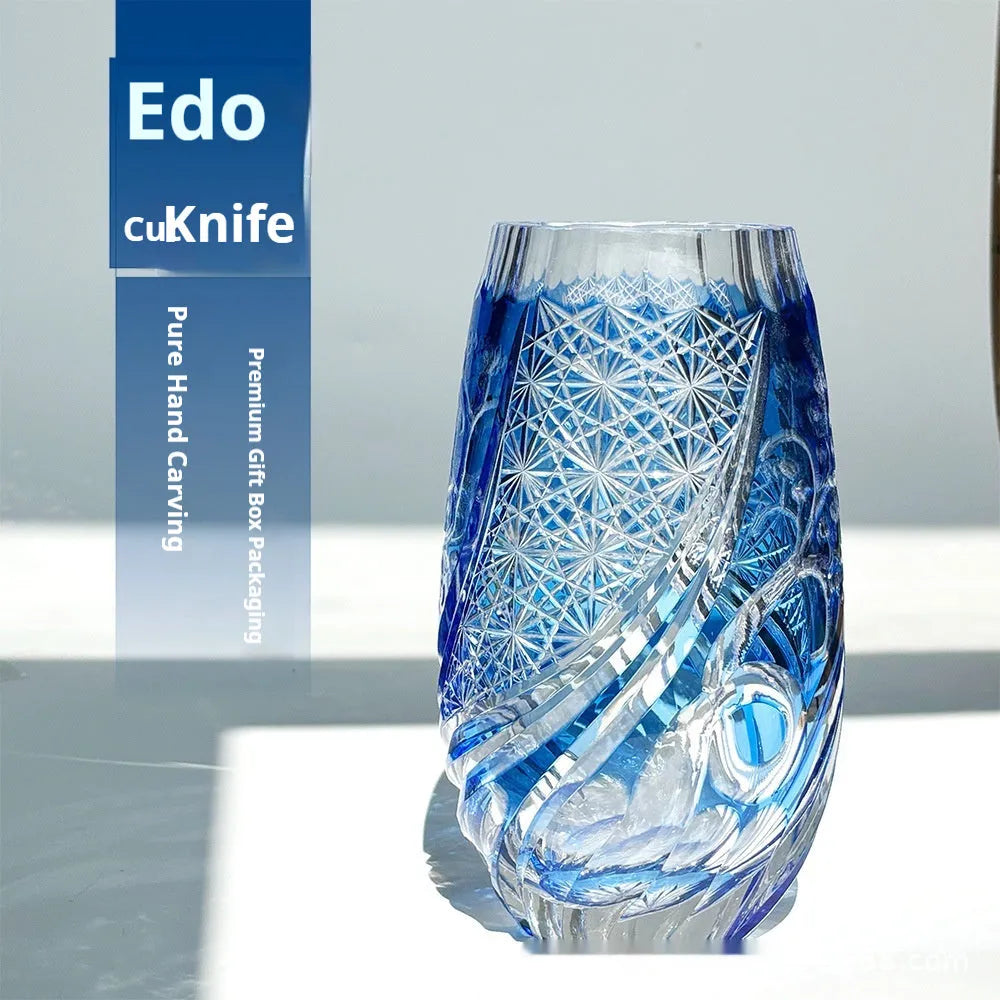 Blue Jianghu cut crystal glass tumbler 80x190mm on a wooden surface