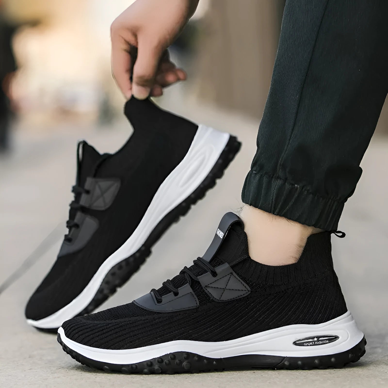 Men's Flyknit low-top running shoes in black with mesh upper and lace-up front.