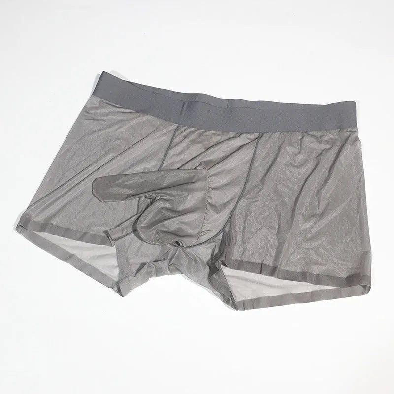 Plus size transparent nylon underwear shorts in skin colour on a hanger, showing seamless mid-waist design.