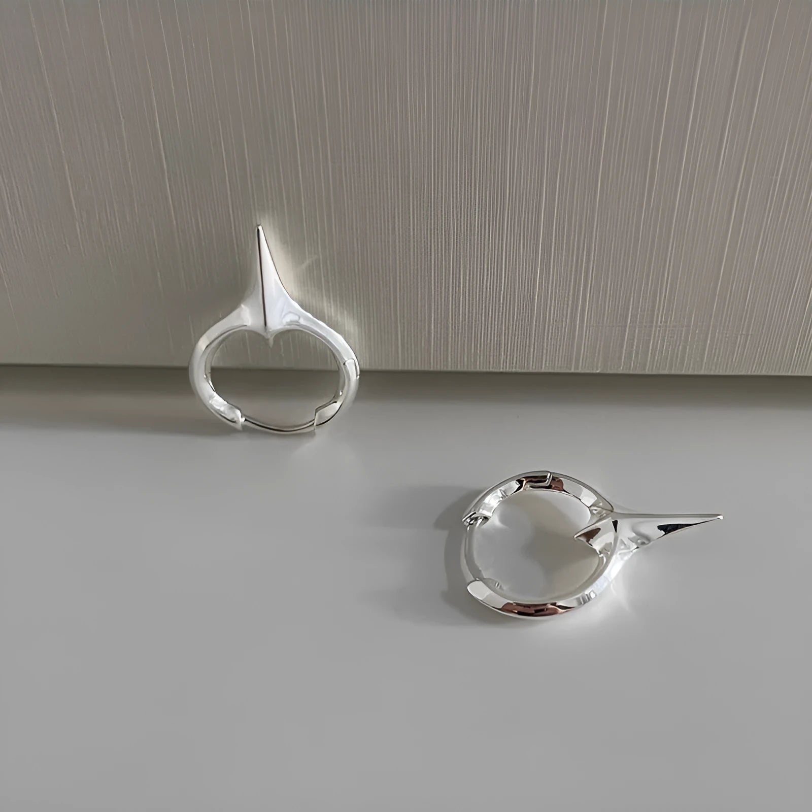Geometric star shape ear clips with white gold electroplated finish, personality statement jewellery for women