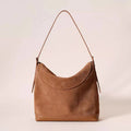 Light brown genuine leather retro style women's shoulder bag with clamshell opening.