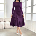Purple women's long sleeve round neck dress with a ruffle detail on a hanger.