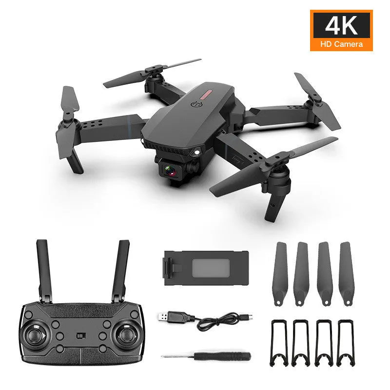 Grey foldable 4K dual camera drone with remote controller on a table.