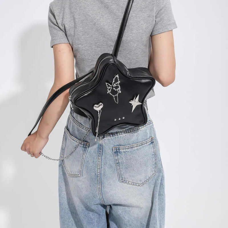 Women's soft PU leather mini backpack messenger bag in black showing crossbody strap
