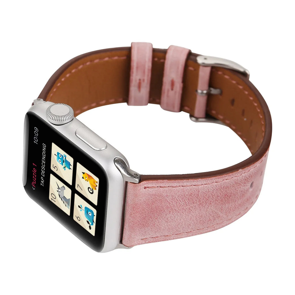 Genuine leather watch strap with a folding buckle in various colours on a grey background.