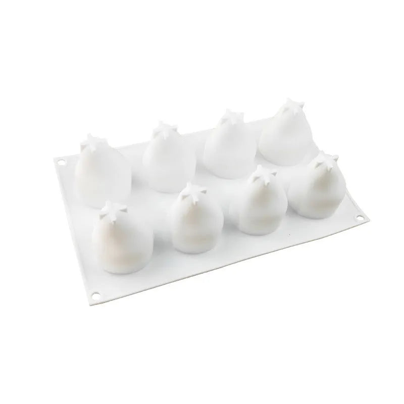 Six-cavity silicone baking mould with detailed pineapple, pine cone, and pear shapes for making Italian mousse.