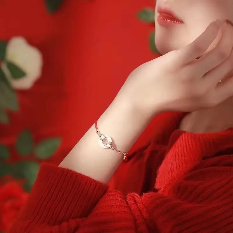 Festive koi bracelet with red rope adjustable closure and peace buckle on mixed materials