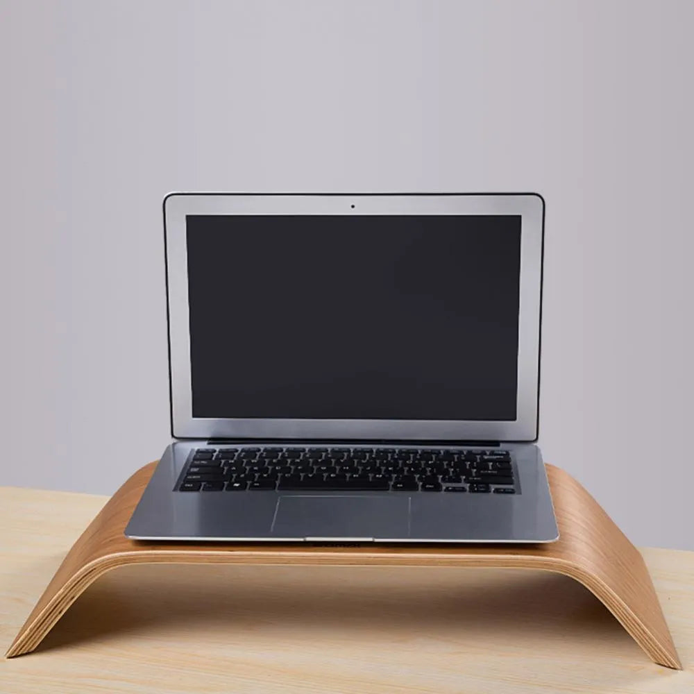 Walnut laptop stand with stability bracket in bamboo leather colour on a desk