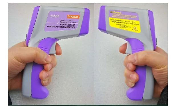 White PK58B non-contact infrared thermometer held near adult forehead with LCD screen showing temperature