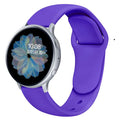 Samsung Galaxy Active 2 smartwatch with a purple silicone replacement strap featuring a reverse buckle clasp.