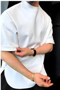 Men's white button-front cotton T-shirt with a round hem on a hanger.