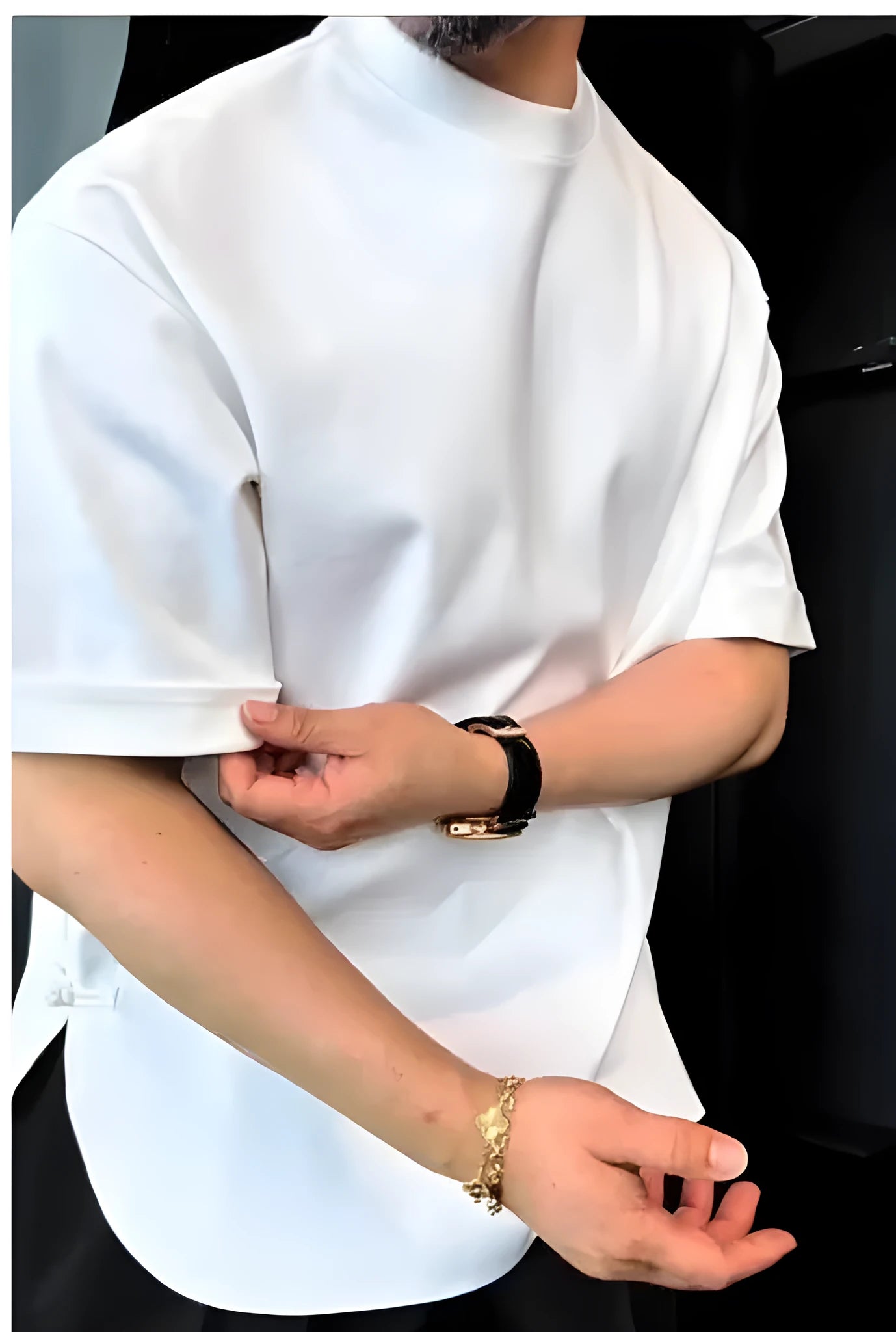 Men's white button-front cotton T-shirt with a round hem on a hanger.