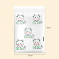 PE car trash adhesive clean bag with green foot dragon design stuck on car door panel