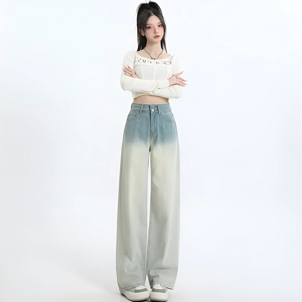 Gradient blue straight-leg denim trousers for women on a hanger, showing the wide-leg cut and colour fade.