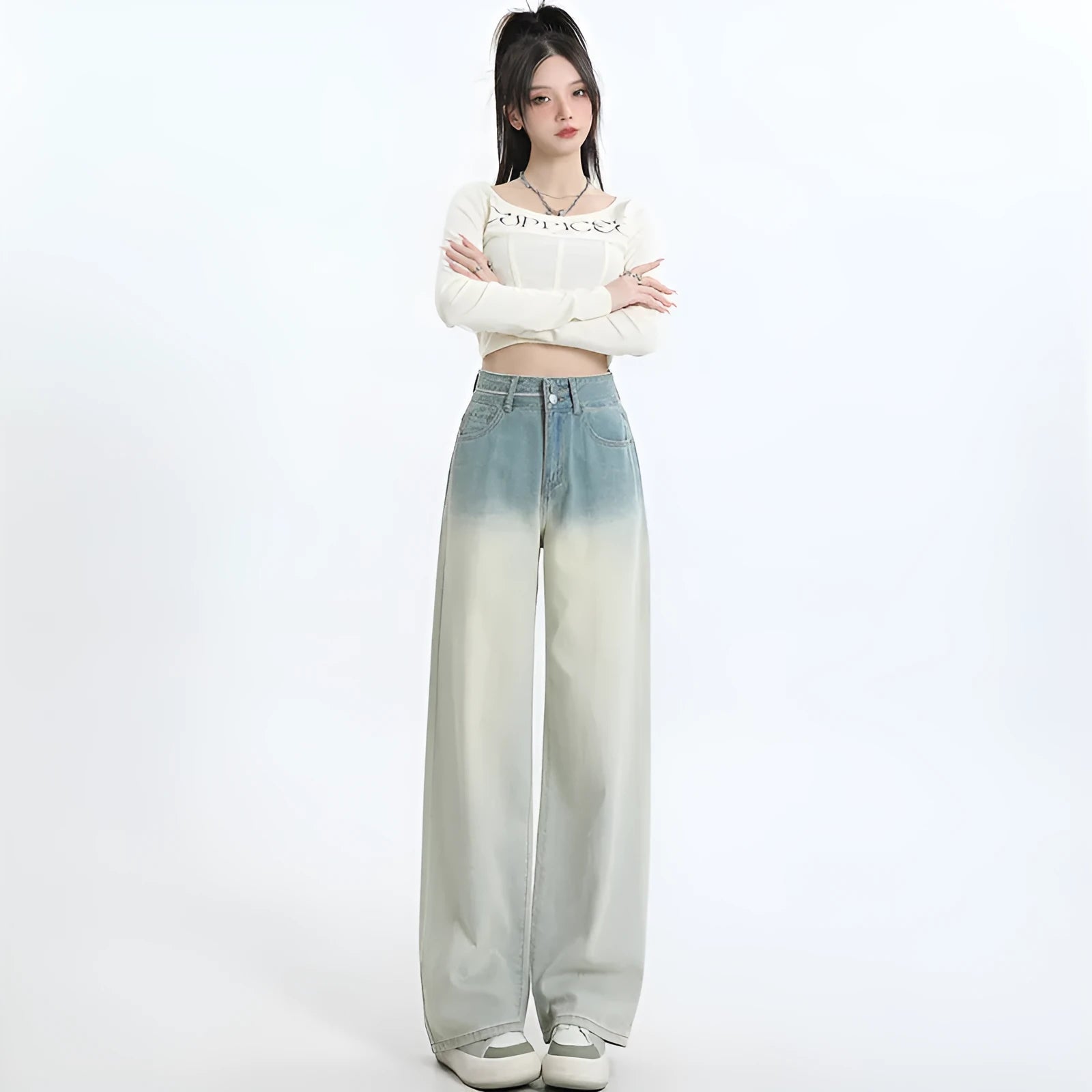 Gradient blue straight-leg denim trousers for women on a hanger, showing the wide-leg cut and colour fade.