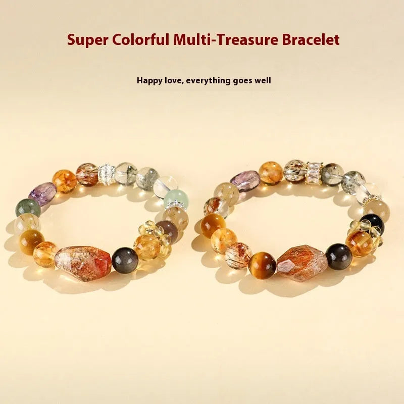 Close-up of a women's black and gold bracelet with natural Super Seven Duobao crystal beads.