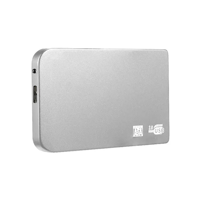 Silver USB 3.0 external solid state hard drive with data cable on a desk.