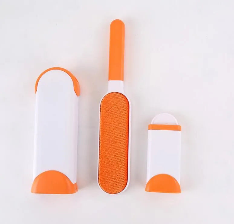 Blue reusable pet hair removal comb with double-sided sticky brush next to its self-cleaning base.