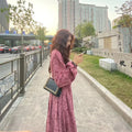 Red cotton floral dress with elastic waist and three-quarter princess sleeves