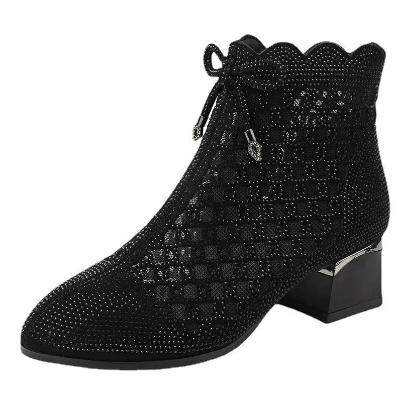 Women's black cutout mesh ankle boots with mid heel and rhinestone trim, side zipper closure