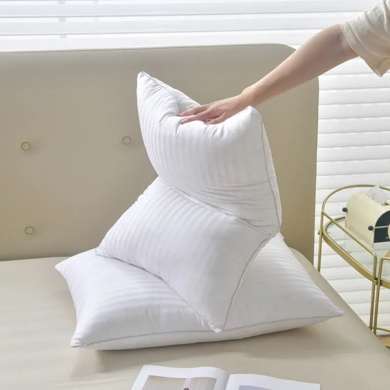 White cotton satin stripe feather pillow showing three size options and loft variations