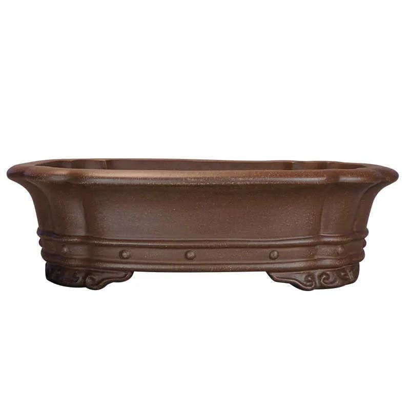 Purple sand handmade antique rectangular begonia flower pot on a desktop.
