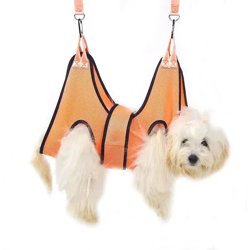 Cat secured in a hammock-style grooming restraint bag for nail cutting or bathing.