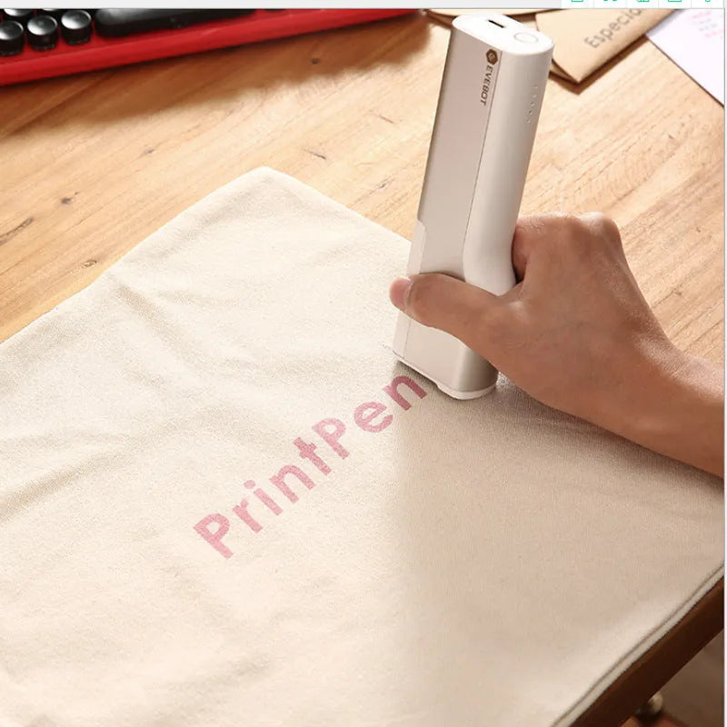 White handheld portable printer with 300dpi accuracy, 26mm print width, Type-C port, and navy blue ink cartridge