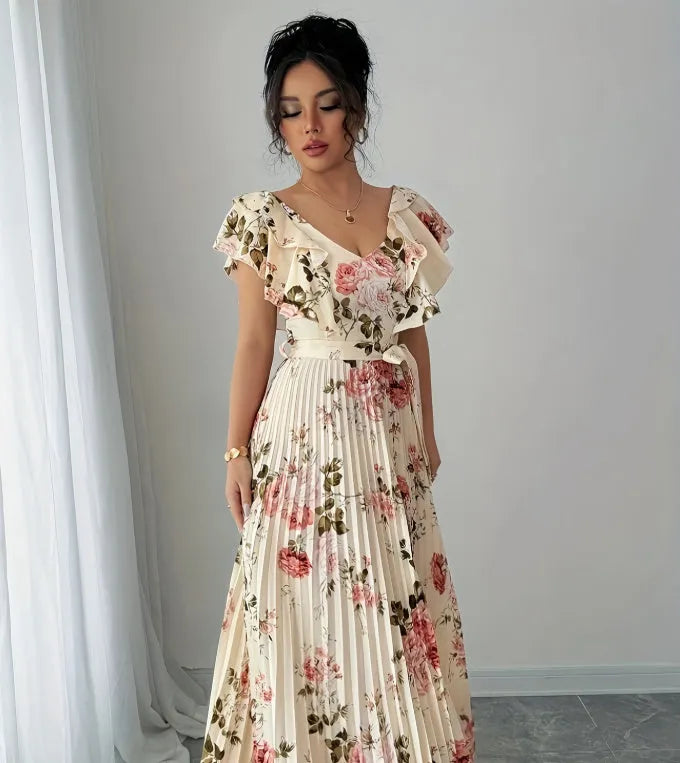 Apricot coloured V-neck dress with digital floral print, ruffled sleeves, and an oversized swing skirt.