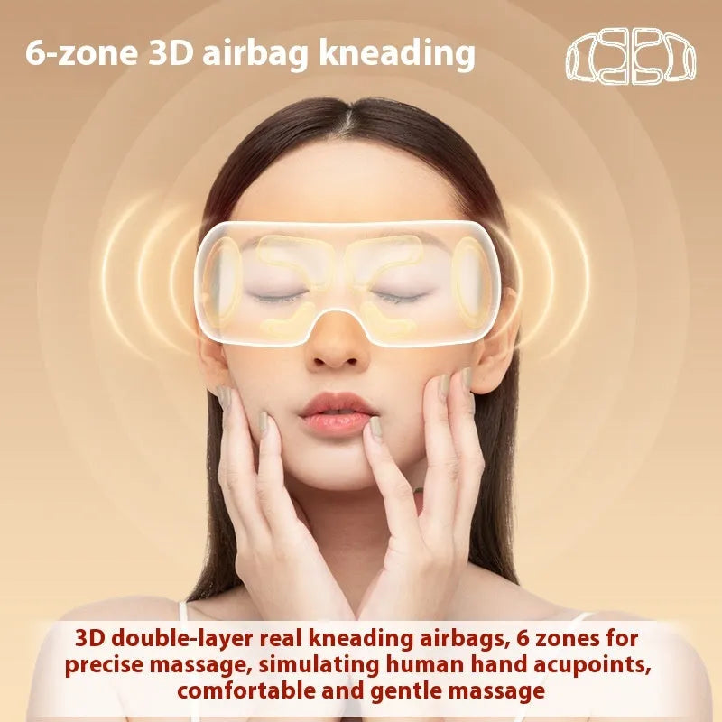 White rechargeable eye massager with airbag compression and hot compress functions on a plain background.