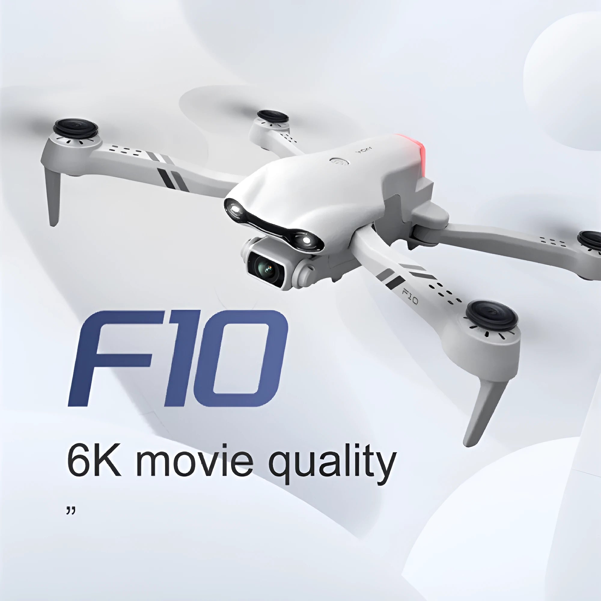 F10 folding GPS drone with 6K dual camera unfolded on a table showing propellers and camera