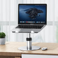 Silver aluminium laptop stand at adjustable height with rotating base and non-slip pads