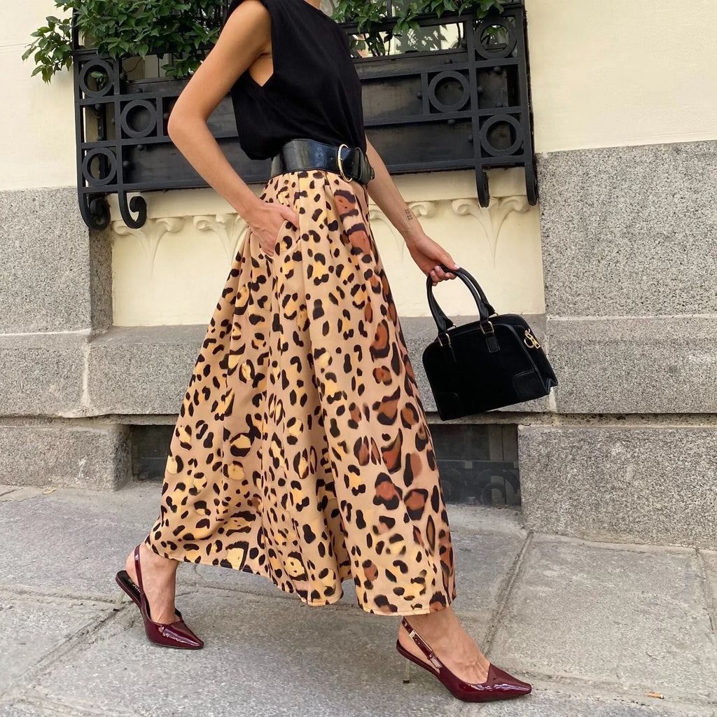 Brown leopard print women's A-line long skirt on a hanger.