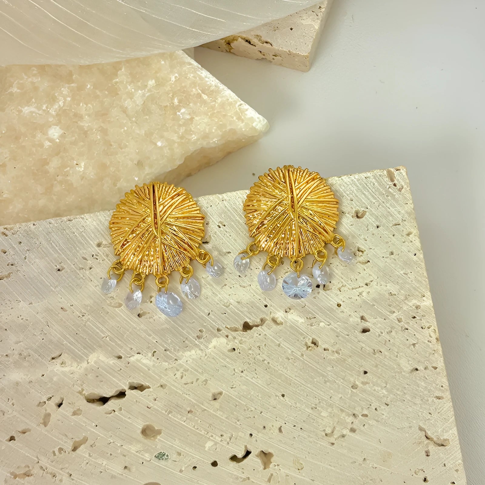 Women's gold geometric hoop earrings with round elements and electroplated finish