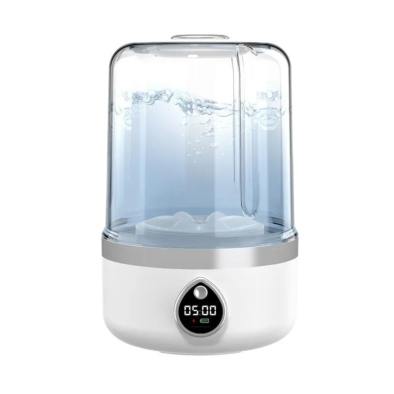 White portable mini washing machine with USB cable on a countertop, showing compact size.